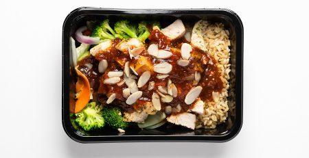 Fit Kitchen healthy meal prep container with a balanced meal.