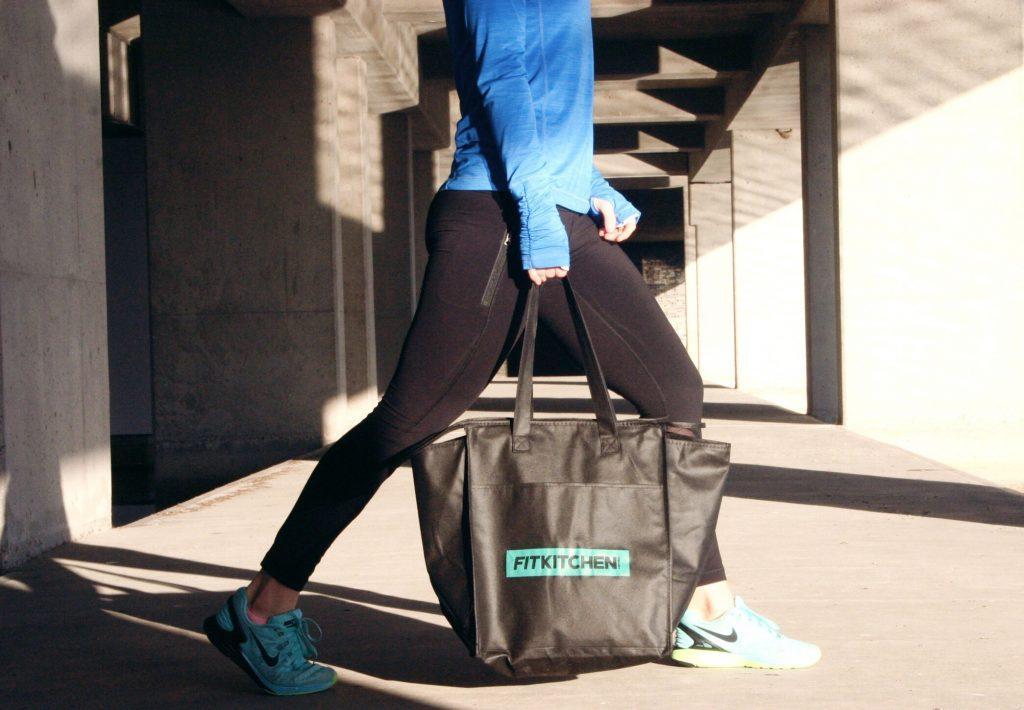 Girl carrying Fit Kitchen bag