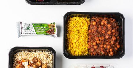 Bunch of healthy meal prep options placed on a white background